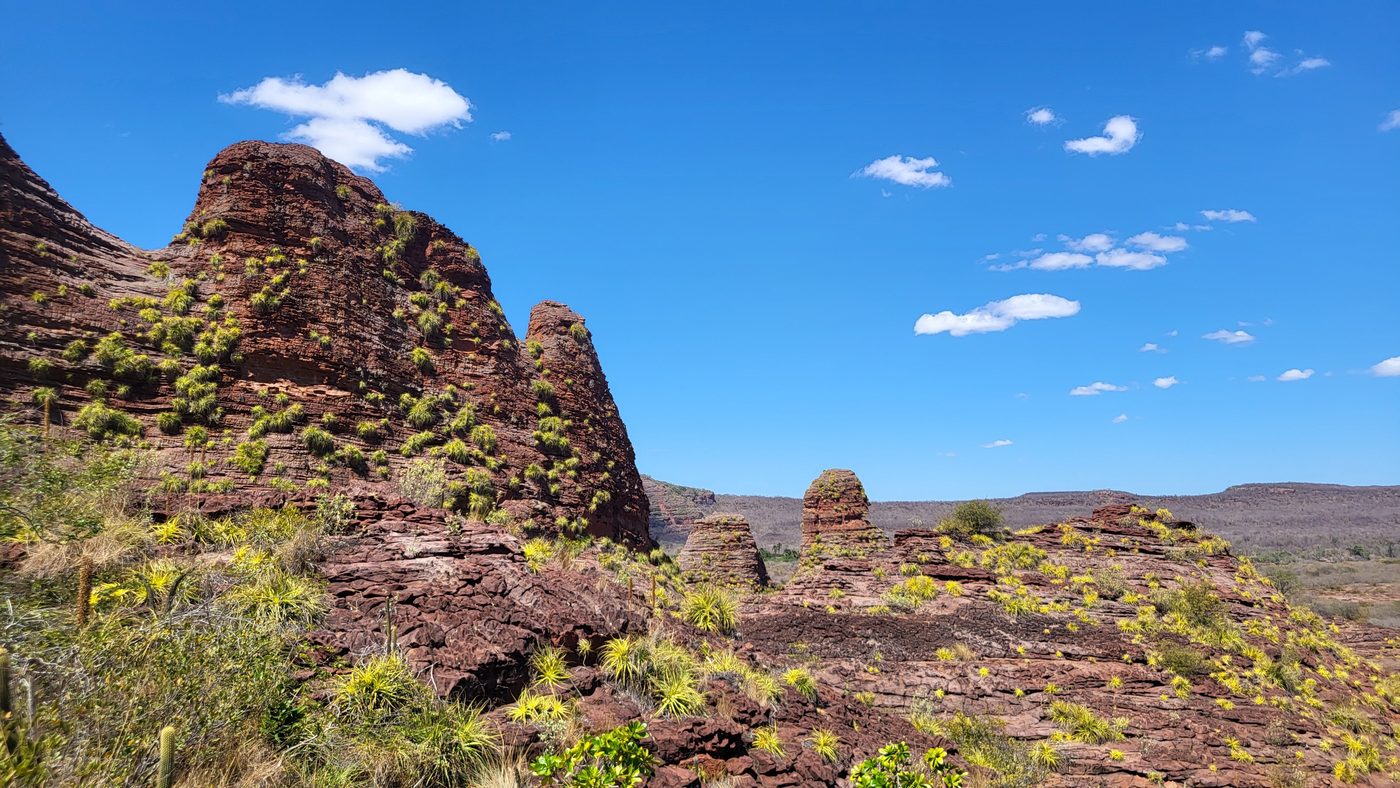 Rock spires at Capadócia Nordestina under a blue sky, scrubland behind